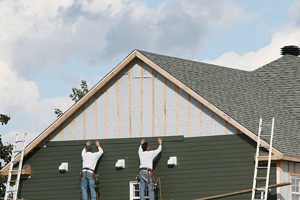 Professional Storm Damage Siding Repair technician working in North Versailles, PA